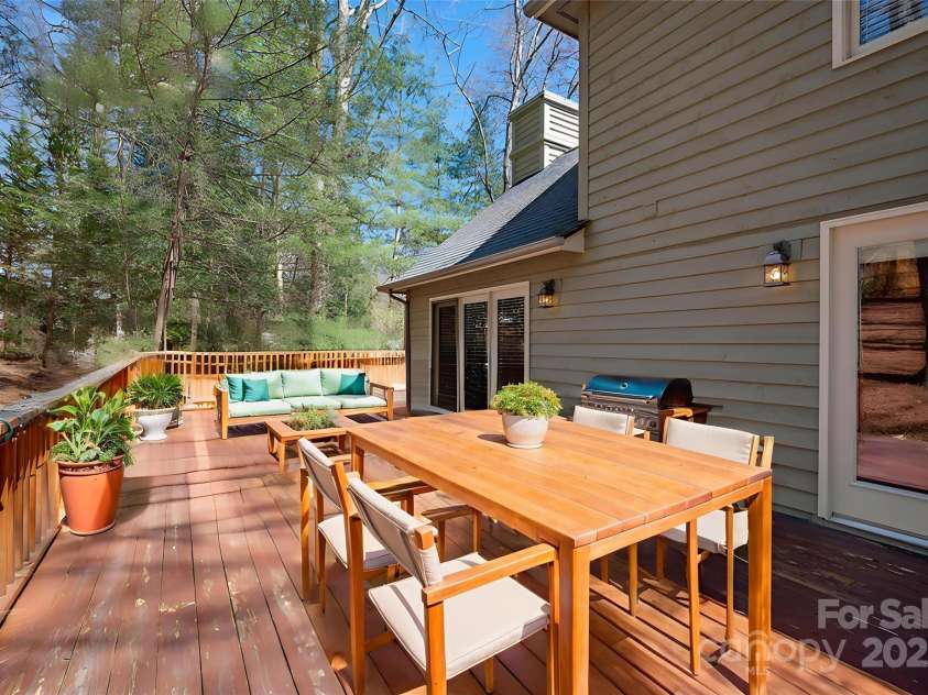 85 Laurel Creek Drive, Asheville, NC 28803.  MLS# CAR4240999, YatesRealty ID 5308. Back porch off of kitchen and eating area