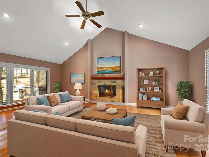 85 Laurel Creek Drive, Asheville, NC 28803.  MLS# CAR4240999, YatesRealty ID 5308. Living room with stack stone fireplace