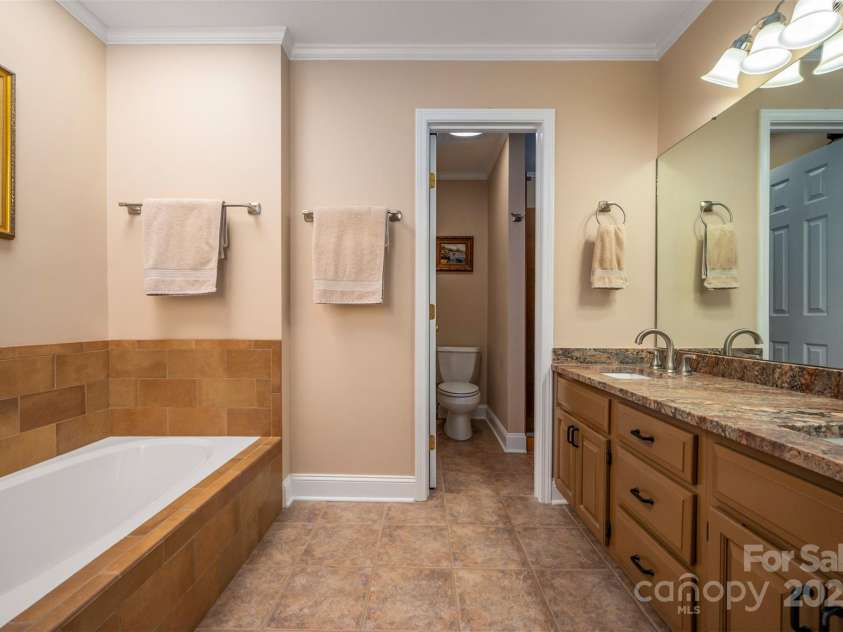 85 Laurel Creek Drive, Asheville, NC 28803.  MLS# CAR4240999, YatesRealty ID 5308. Primary bathroom