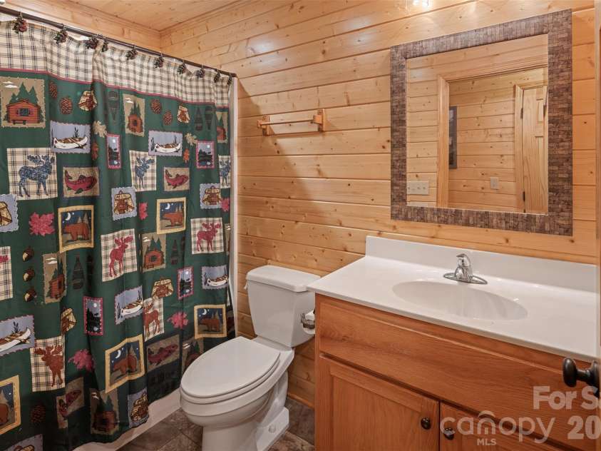 128 Deer Antler Drive, Purlear, NC 28665.  MLS# CAR4360254, YatesRealty ID 5309. Guest Bathroom