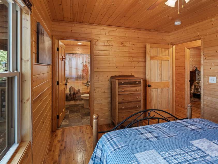 128 Deer Antler Drive, Purlear, NC 28665.  MLS# CAR4360254, YatesRealty ID 5309. Primary Bedroom with Ensuite Bathroom