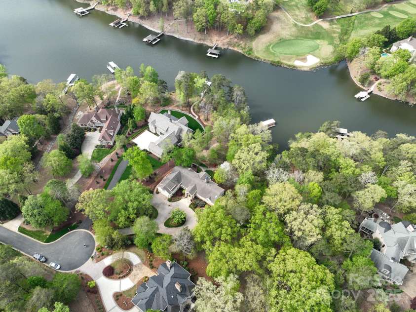 345 Porters Glen None, New London, NC 28127.  MLS# CAR4241295, YatesRealty ID 5309. Aerial View of Home Lake and Golf Course