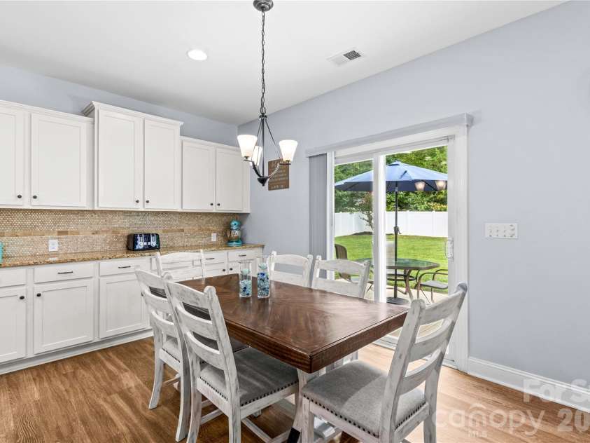 111 Paradise Hills Circle, Mooresville, NC 28115.  MLS# CAR4428377, YatesRealty ID 53114. Dining overlooks Back Yard