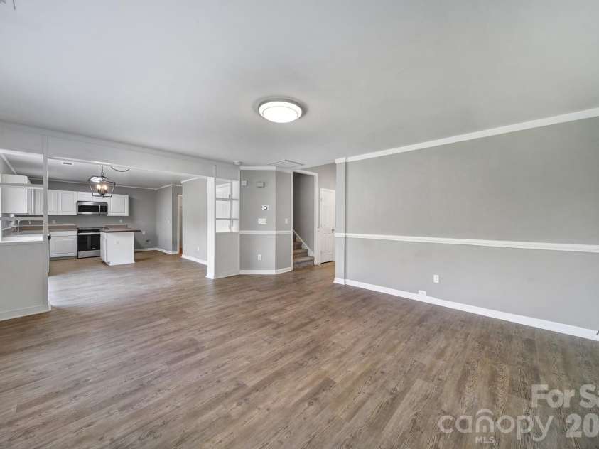 5228 Moonlight Trail, Concord, NC 28025.  MLS# CAR4425207, YatesRealty ID 53223. Family room flows into the dining room and kitchen