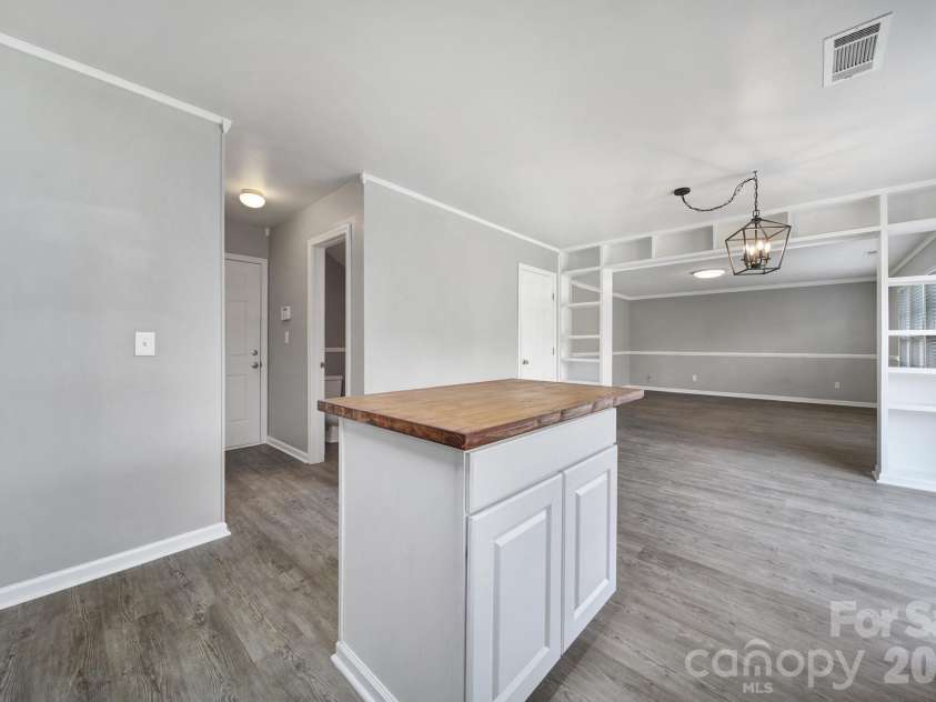 5228 Moonlight Trail, Concord, NC 28025.  MLS# CAR4425207, YatesRealty ID 53223. Laundry Room and Half-Bath located in the hallway towards garage entry.