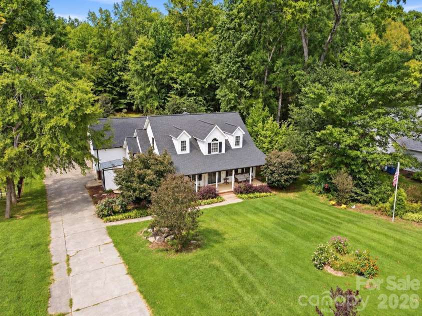 8866 Oldenburg Drive, Mount Pleasant, NC 28124.  MLS# CAR4427588, YatesRealty ID 53252. Property surrounded by trees!