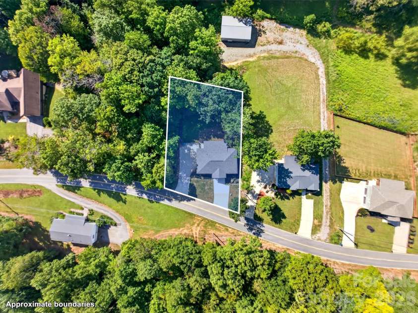 131 Ridge Road, Candler, NC 28715.  MLS# CAR4427732, YatesRealty ID 53263. .42 acres