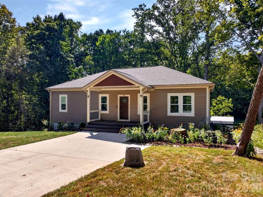 131 Ridge Road, Candler, NC 28715.  MLS# CAR4427732, YatesRealty ID 53263. Flat front yard and gardens