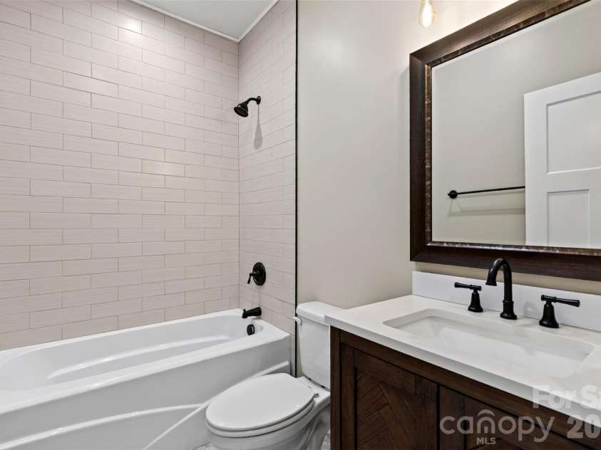 131 Ridge Road, Candler, NC 28715.  MLS# CAR4427732, YatesRealty ID 53263. Guest bathroom upstairs