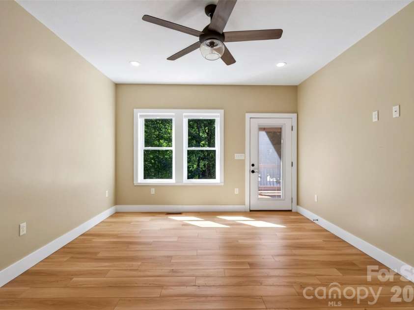 131 Ridge Road, Candler, NC 28715.  MLS# CAR4427732, YatesRealty ID 53263. Porch access from primary bedroom
