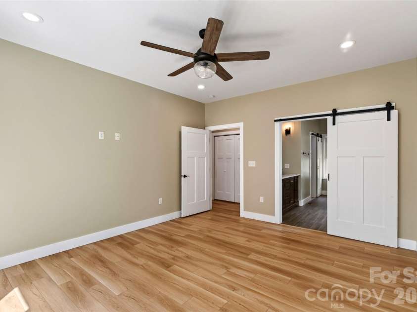 131 Ridge Road, Candler, NC 28715.  MLS# CAR4427732, YatesRealty ID 53263. Primary en-suite bedroom