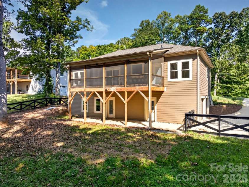 131 Ridge Road, Candler, NC 28715.  MLS# CAR4427732, YatesRealty ID 53263. Tranquil covered and screened-in porch