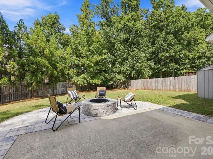 1268 Saint Johns Avenue, Stallings, NC 28104.  MLS# CAR4422083, YatesRealty ID 53269. Backyard with firepit