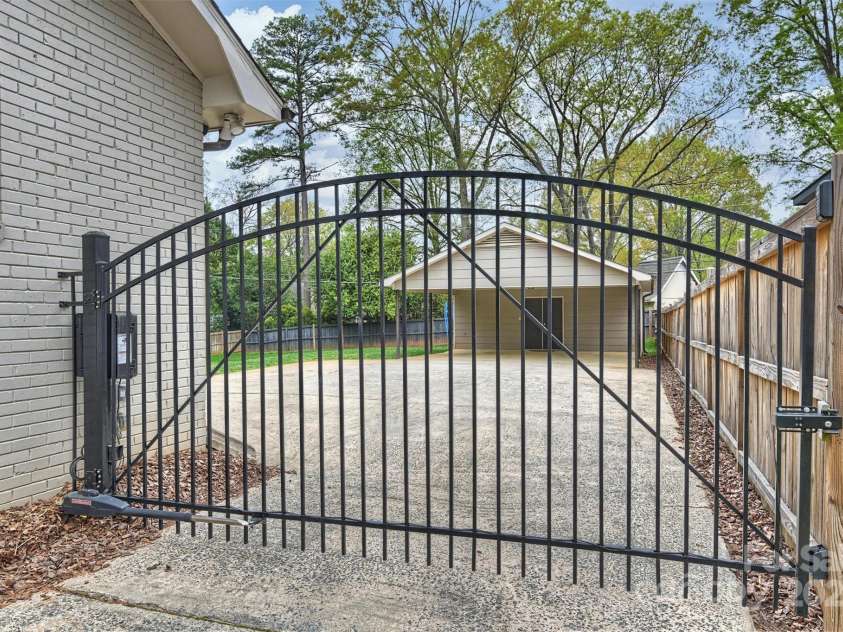 500 Lansdowne Road, Charlotte, NC 28270.  MLS# CAR4240388, YatesRealty ID 5327. Automatic gate and fully fenced backyard.