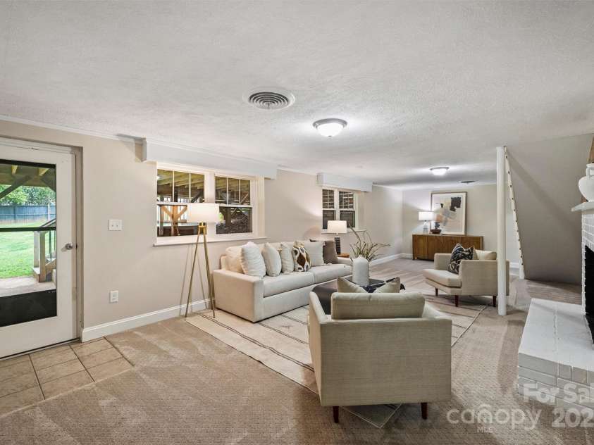500 Lansdowne Road, Charlotte, NC 28270.  MLS# CAR4240388, YatesRealty ID 5327. Living Area on Lower Level with access to backyard.