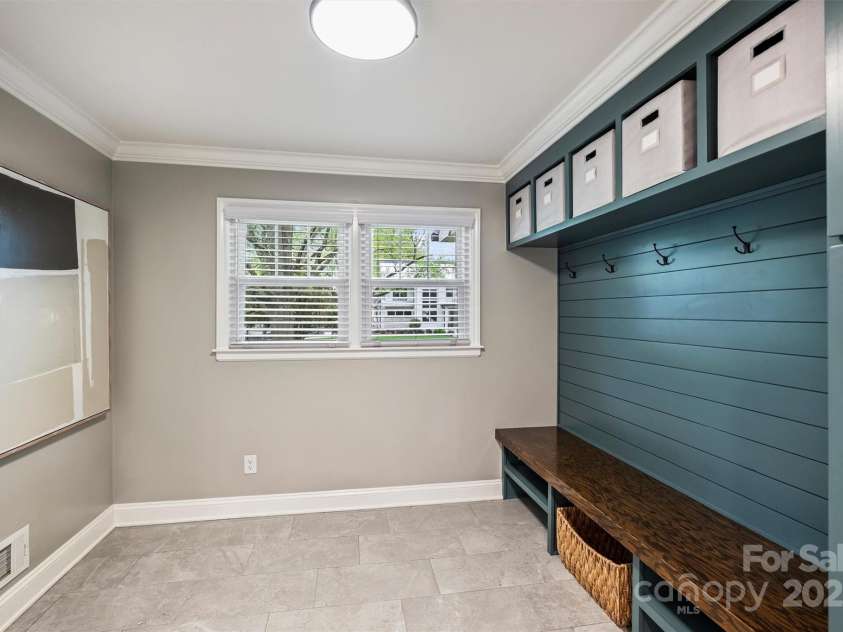500 Lansdowne Road, Charlotte, NC 28270.  MLS# CAR4240388, YatesRealty ID 5327. Mudroom off of the one-car attached garage features built-in storage for additional functionality.