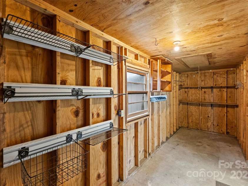 500 Lansdowne Road, Charlotte, NC 28270.  MLS# CAR4240388, YatesRealty ID 5327. Outdoor storage space off of detached 2-car carport.