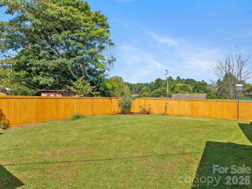 106 Mohican Trail, East Flat Rock, NC 28726.  MLS# CAR4427684, YatesRealty ID 53292. Back yard