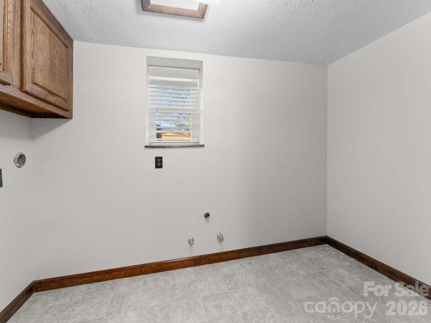 106 Mohican Trail, East Flat Rock, NC 28726.  MLS# CAR4427684, YatesRealty ID 53292. Laundry Room