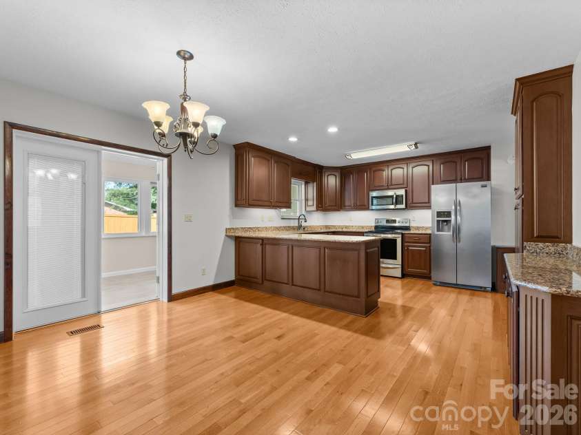 106 Mohican Trail, East Flat Rock, NC 28726.  MLS# CAR4427684, YatesRealty ID 53292. Staged Dining Area in Kitchen