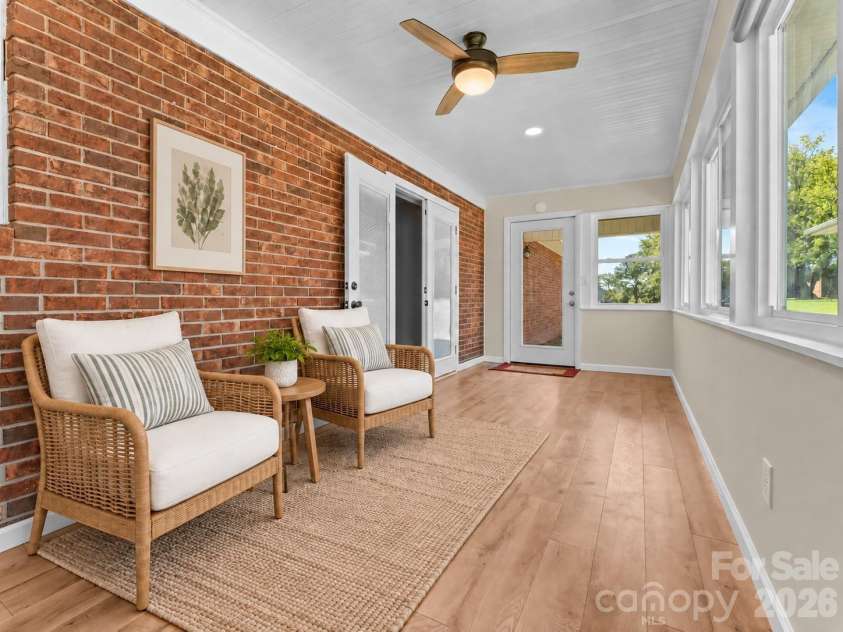 106 Mohican Trail, East Flat Rock, NC 28726.  MLS# CAR4427684, YatesRealty ID 53292. Staged sunroom
