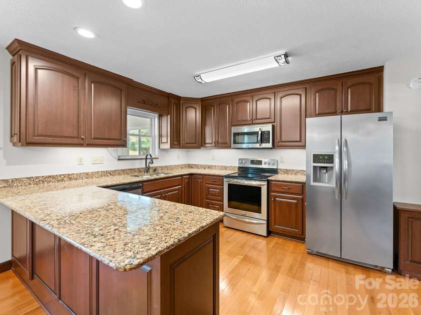 106 Mohican Trail, East Flat Rock, NC 28726.  MLS# CAR4427684, YatesRealty ID 53292. Updated Kitchen with solid surface counter tops & stainless appliances