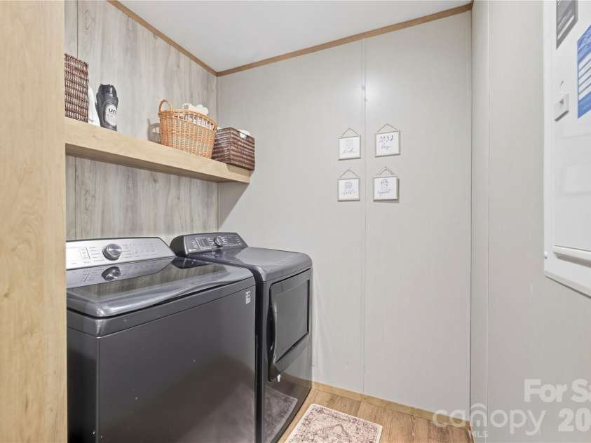 371 Piney Ridge Drive, Hendersonville, NC 28791.  MLS# CAR4428835, YatesRealty ID 53293. Laundry room off kitchen