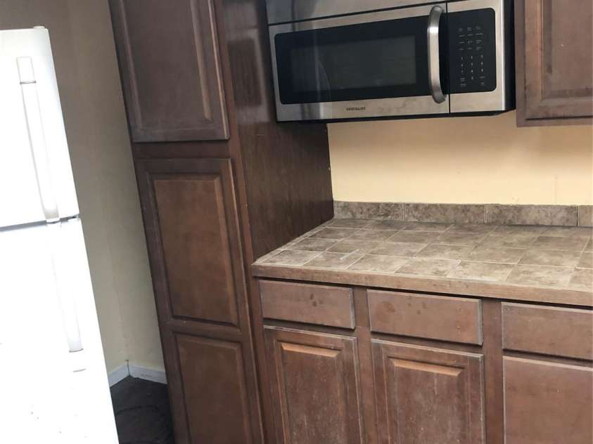 217 Salisbury Street, Rockwell, NC 28138.  MLS# CAR4428797, YatesRealty ID 53299. Kitchen in basement
