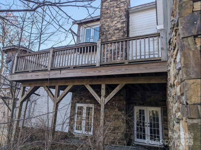 1605 Golden Road, Lake Toxaway, NC 28747.  MLS# CAR4179199, YatesRealty ID 533. Back Deck and Basement entrance