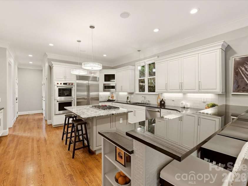 14812 Jockeys Ridge Drive, Charlotte, NC 28277.  MLS# CAR4427762, YatesRealty ID 53315. Chef's kitchen 0 Wolf 5 Burner Stove, Double Ovens, Sub-Zero refrigerator