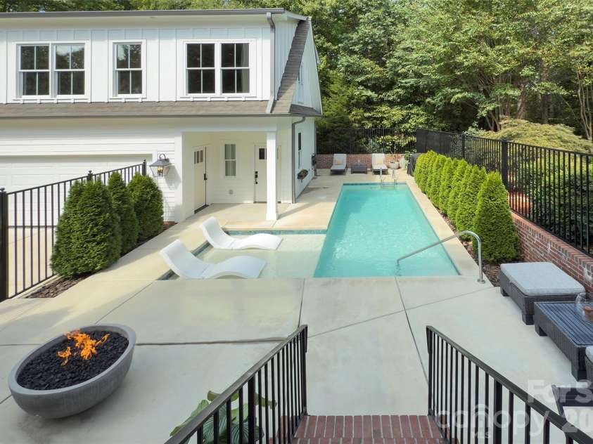 2561 Lower Assembly Drive, Fort Mill, SC 29708.  MLS# CAR4423354, YatesRealty ID 53337. Backyard with gas firepit and saltwater punge pool