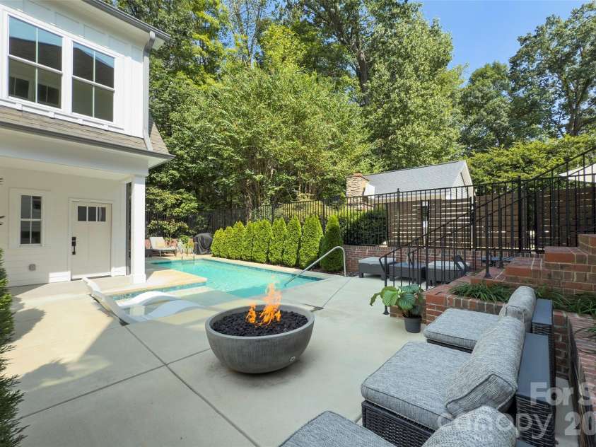 2561 Lower Assembly Drive, Fort Mill, SC 29708.  MLS# CAR4423354, YatesRealty ID 53337. Backyard with gas firepit and saltwater punge pool