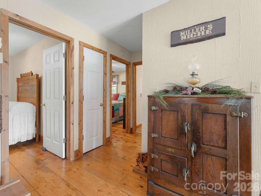 600 Piney Gate Road, Saluda, NC 28773.  MLS# CAR4423662, YatesRealty ID 53356. Hall to bedrooms and bath.