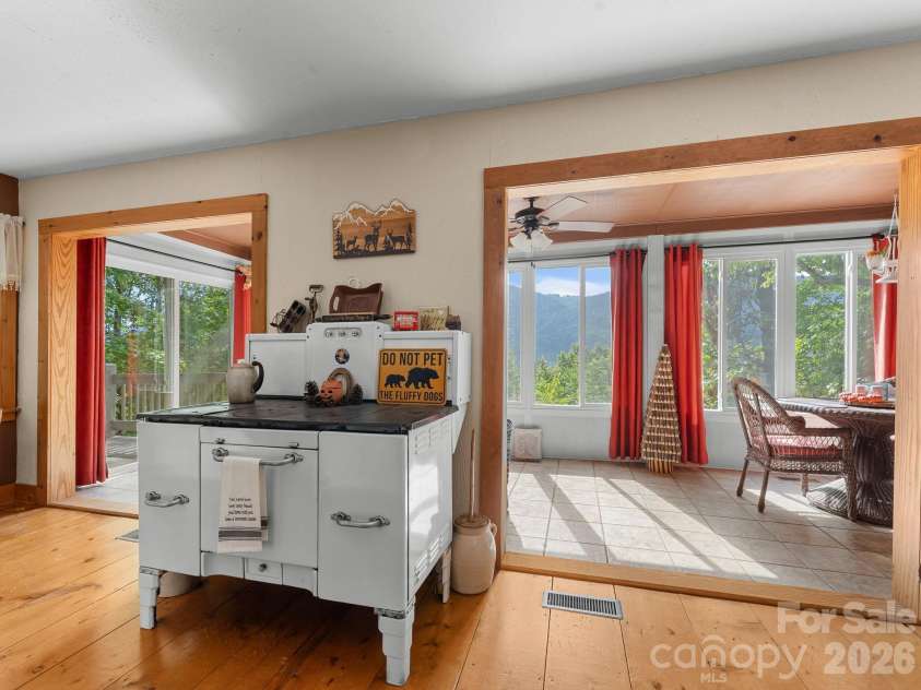 600 Piney Gate Road, Saluda, NC 28773.  MLS# CAR4423662, YatesRealty ID 53356. Kitchen open to sun room