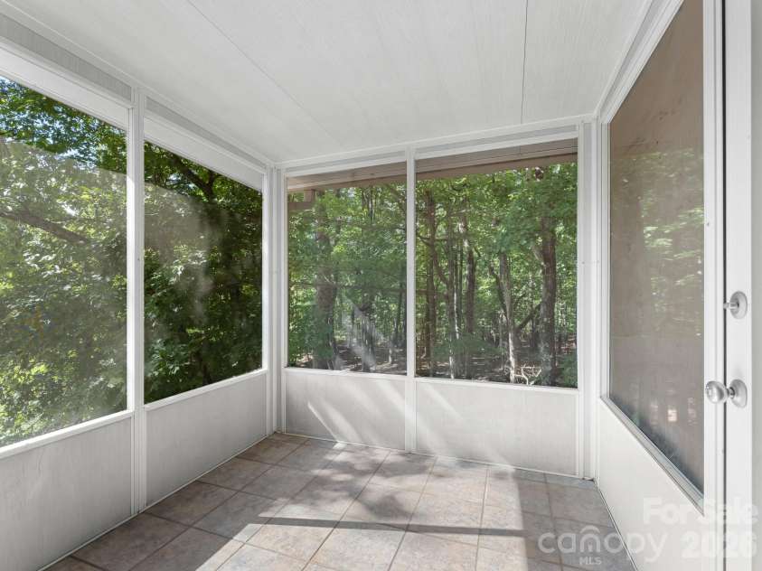 600 Piney Gate Road, Saluda, NC 28773.  MLS# CAR4423662, YatesRealty ID 53356. Screened porch