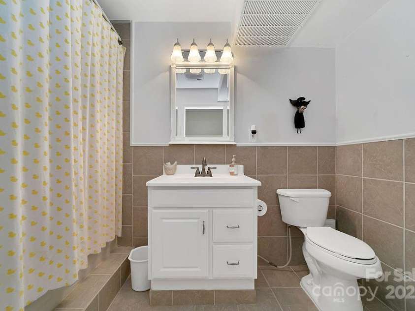 57 Echota Lane, Brevard, NC 28712.  MLS# CAR4230498, YatesRealty ID 5336. Basement Full Bath