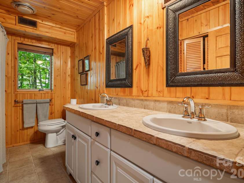 342 Granny Lewis Lane, Mars Hill, NC 28754.  MLS# CAR4428458, YatesRealty ID 53365. Lower level bathroom