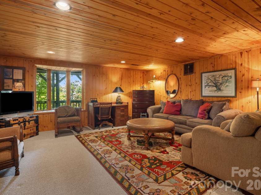 342 Granny Lewis Lane, Mars Hill, NC 28754.  MLS# CAR4428458, YatesRealty ID 53365. Lower level living room