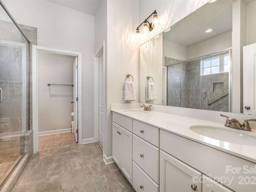 456 Lucky Drive, Concord, NC 28027.  MLS# CAR4235721, YatesRealty ID 5338. Primary bedroom and ensuite bathroom