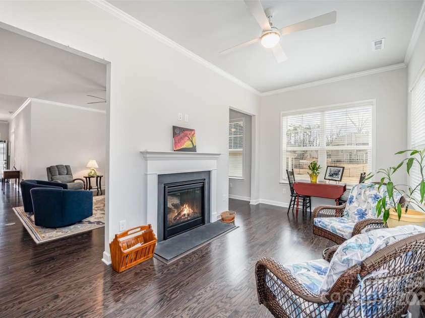 456 Lucky Drive, Concord, NC 28027.  MLS# CAR4235721, YatesRealty ID 5338. Sunroom with fireplace.