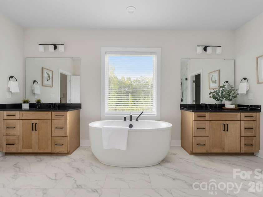 4230 Tournette Drive, Indian Land, SC 29707.  MLS# CAR4423443, YatesRealty ID 53382. Primary bath double vanities with black quartz counters