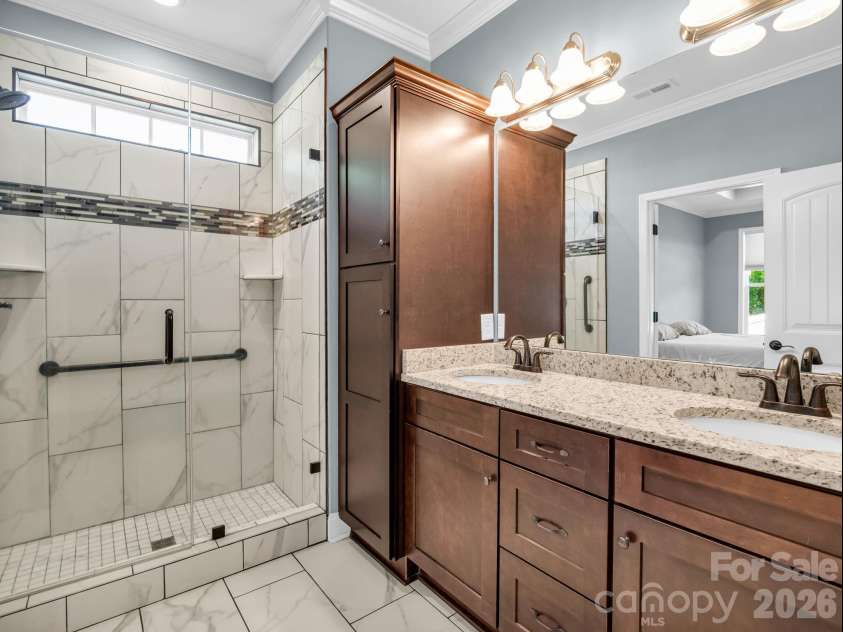178 Page Creek Boulevard, Landrum, SC 29356.  MLS# CAR4428933, YatesRealty ID 53387. Primary bathroom with tile shower