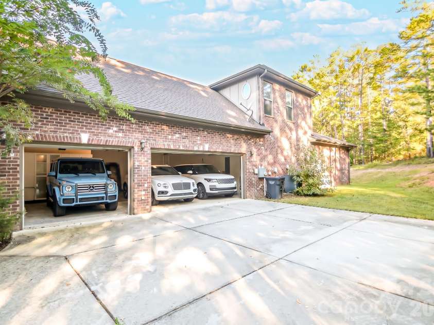 16202 Monnet Place Court, Charlotte, NC 28278.  MLS# CAR4428838, YatesRealty ID 53389. Side Load 3 Car Garage with Vehicles