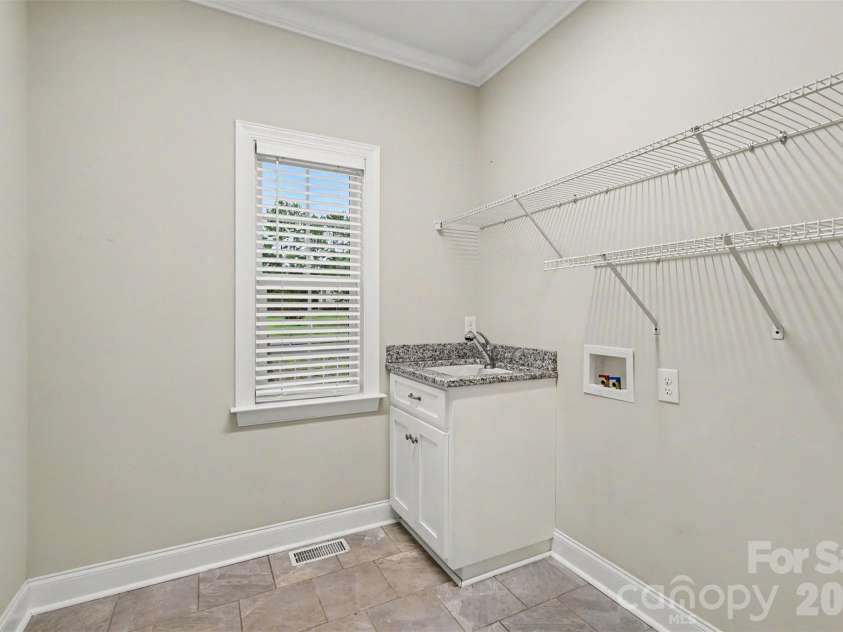 3743 Travertine Drive, Lancaster, SC 29720.  MLS# CAR4426417, YatesRealty ID 53396. Very large main floor laundry