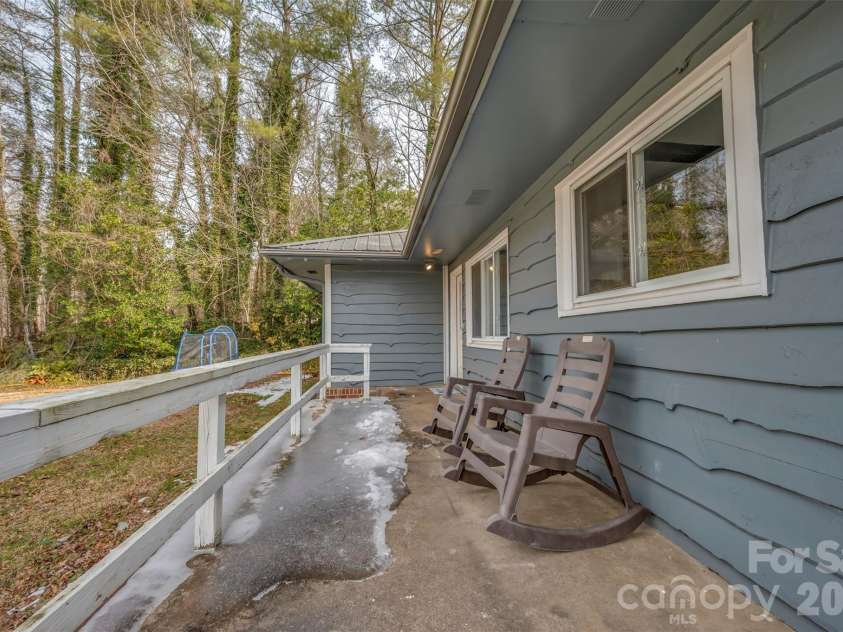 1685 Lynn Road, Columbus, NC 28722.  MLS# CAR4341868, YatesRealty ID 5341. Spacious porch wraps around three sides!