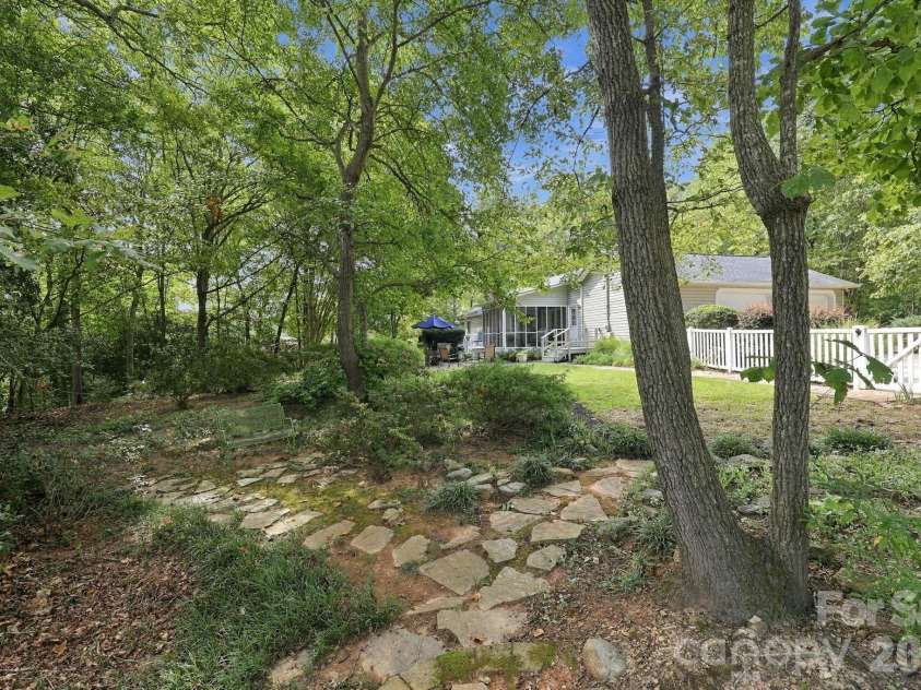 31883 Ameron Circle, Albemarle, NC 28001.  MLS# CAR4426721, YatesRealty ID 53423. Backyard hidden garden spaces.