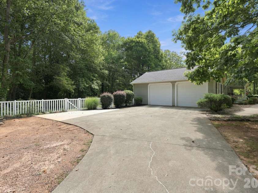 31883 Ameron Circle, Albemarle, NC 28001.  MLS# CAR4426721, YatesRealty ID 53423. There is an attached 2 car garage with a storage area inside.