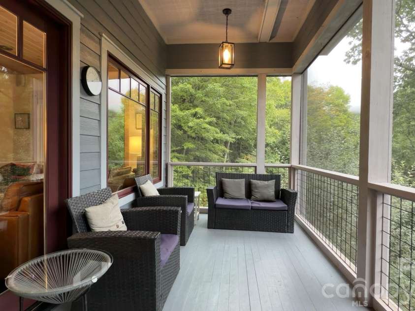 18 Wood Haven Lane, Black Mountain, NC 28711.  MLS# CAR4428632, YatesRealty ID 53432. Spacious Screened-In Deck
