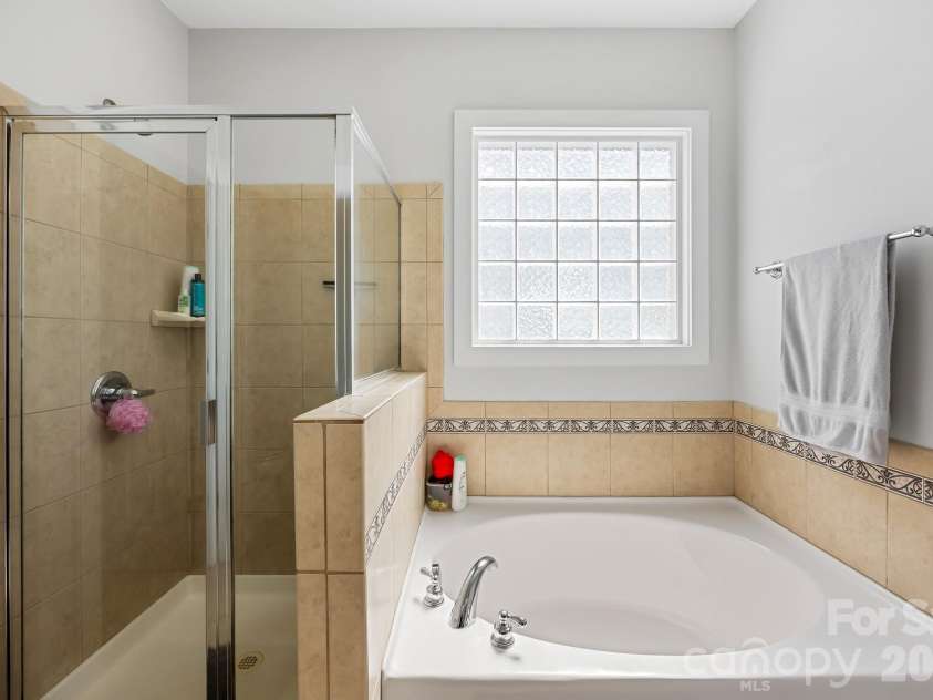 125 Water Oak Drive, Mooresville, NC 28117.  MLS# CAR4428333, YatesRealty ID 53436. Primary bathroom on main