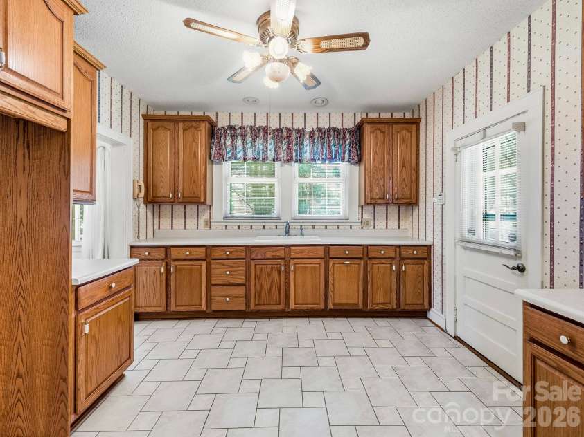 1308 Charlotte Highway, Fairview, NC 28730.  MLS# CAR4429052, YatesRealty ID 53437. Oak cabients galore